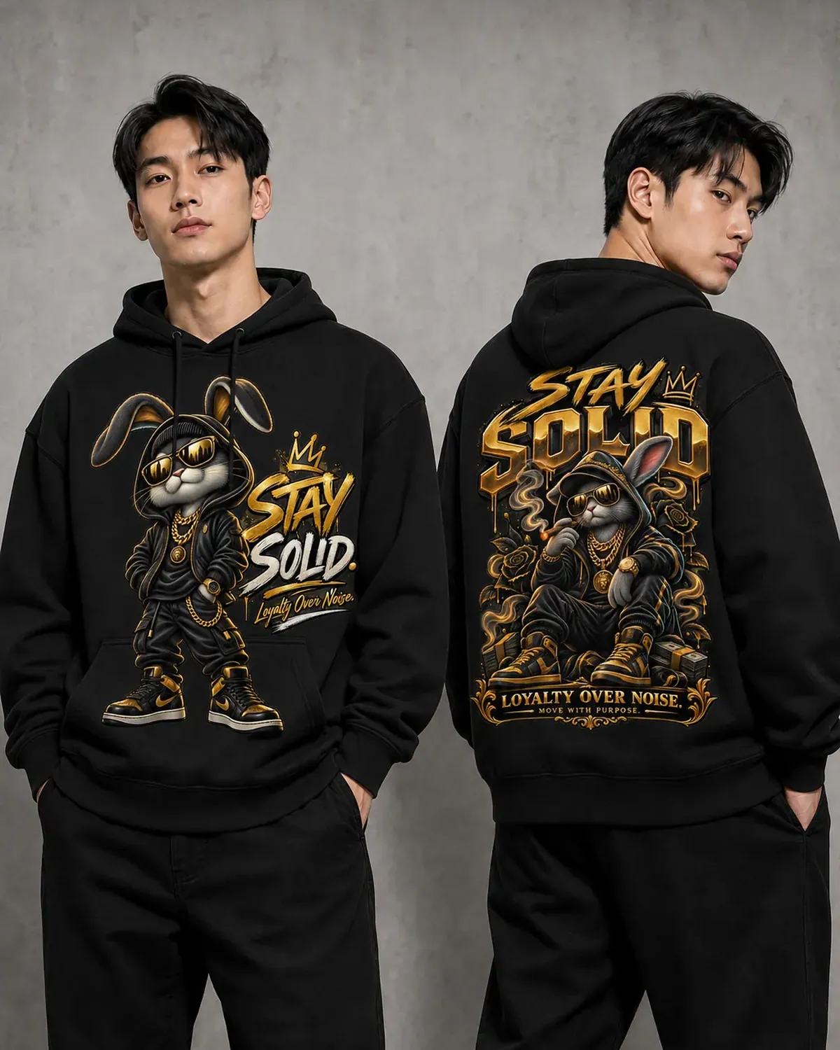 Black Stay Solid graphic hoodie — a cartoon rabbit in a gold crown and tracksuit, chains swinging, gold , hand-printed in NJ