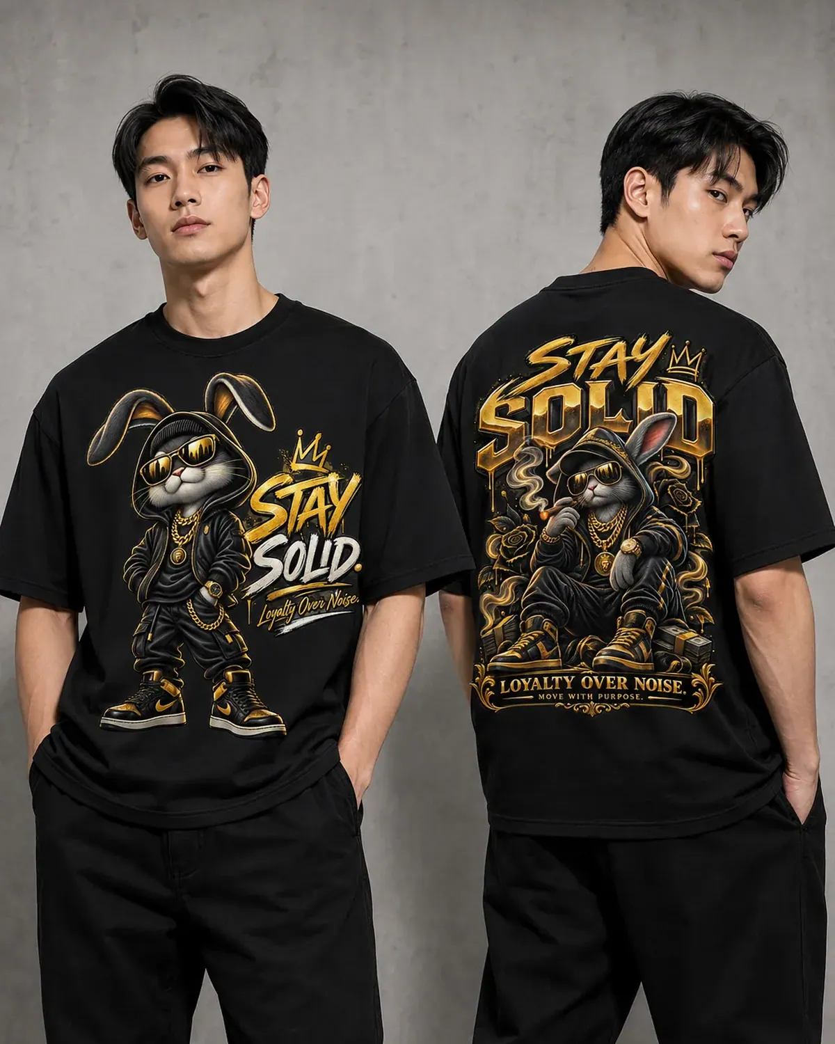 Black Stay Solid graphic tee — a cartoon rabbit in a gold crown and tracksuit, chains swinging, gold , hand-printed in NJ